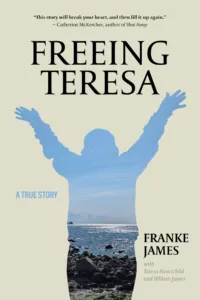 A book cover. Text on the front reads: Freeing teresa. A true story. Franke James with Teresa Heartchild and Billiam James