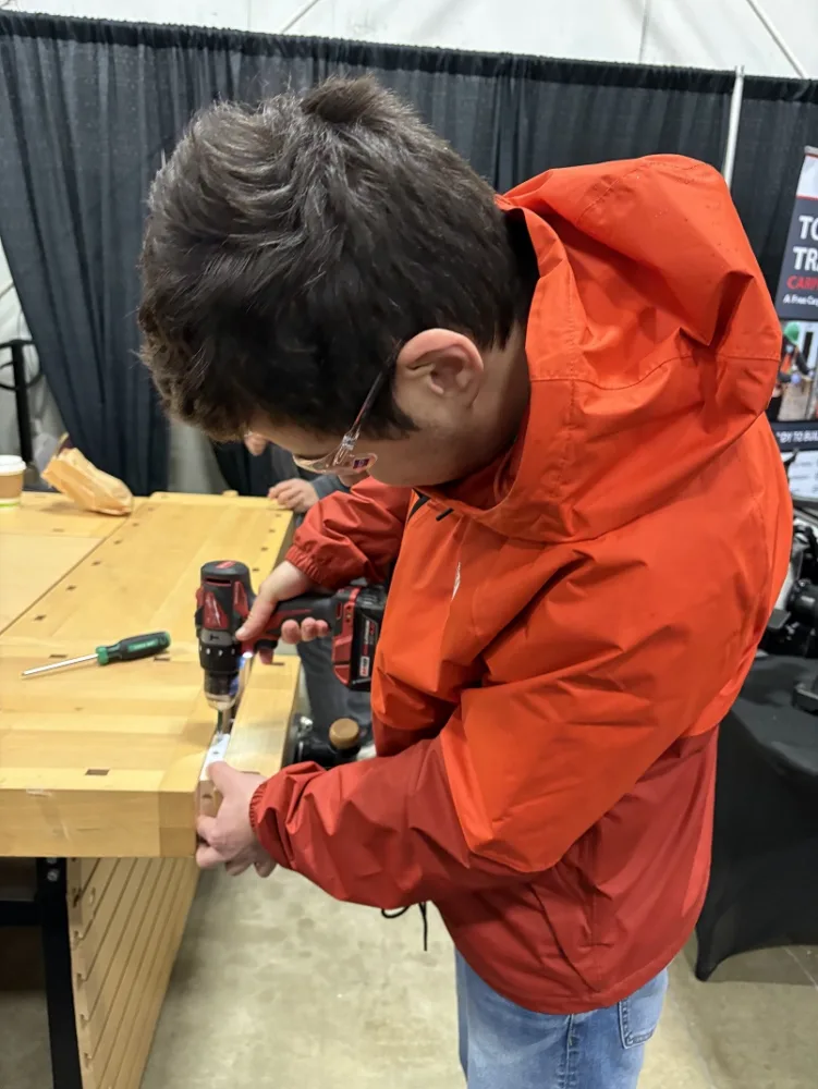 person using a drill